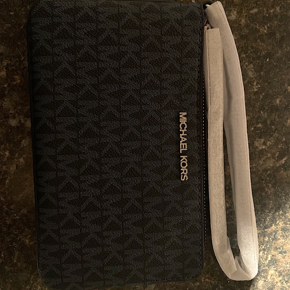 Michael Kors large wristlet. Never used with tags.